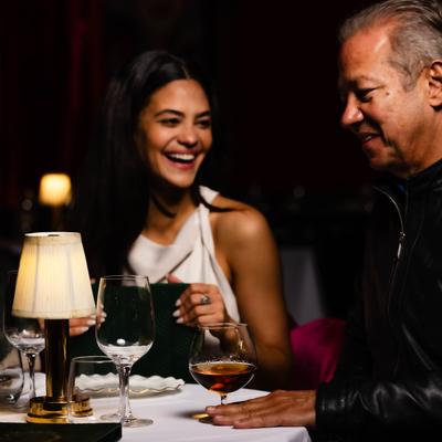 Dining table scene with guests enjoining the ambiance.