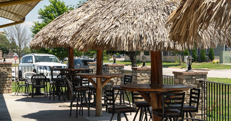Exterior, tall tables and chairs and parasols