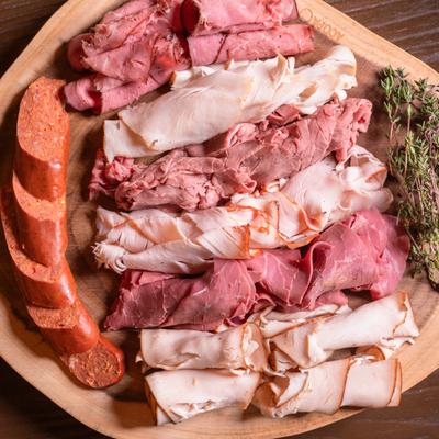 Board with deli meats.