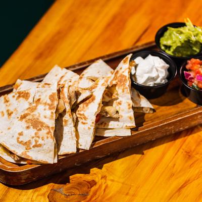 Chicken Quesadillas, with sour cream, guacamole, and pico de gallo.