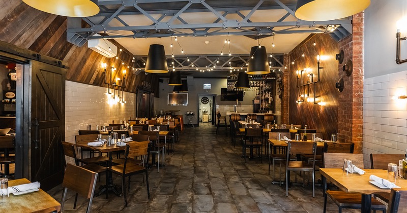 Restaurant interior, cozy dining area with set dining tables