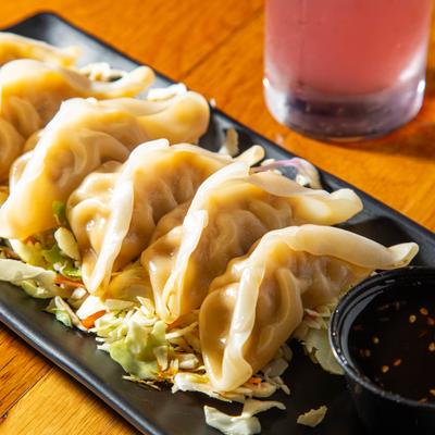 Blend of cabbage and chicken dumplings served with tangy teriyaki