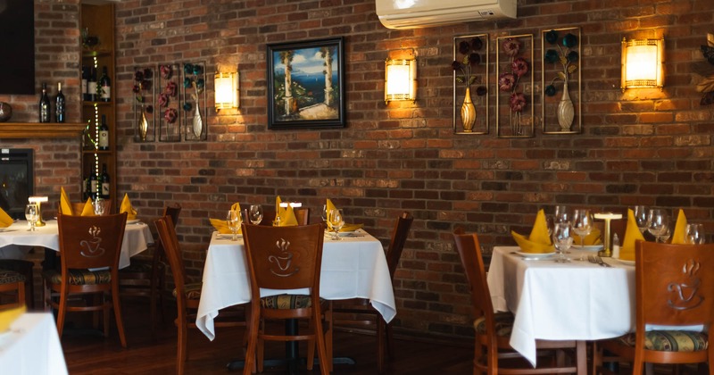 Interior, tables near the brick wall