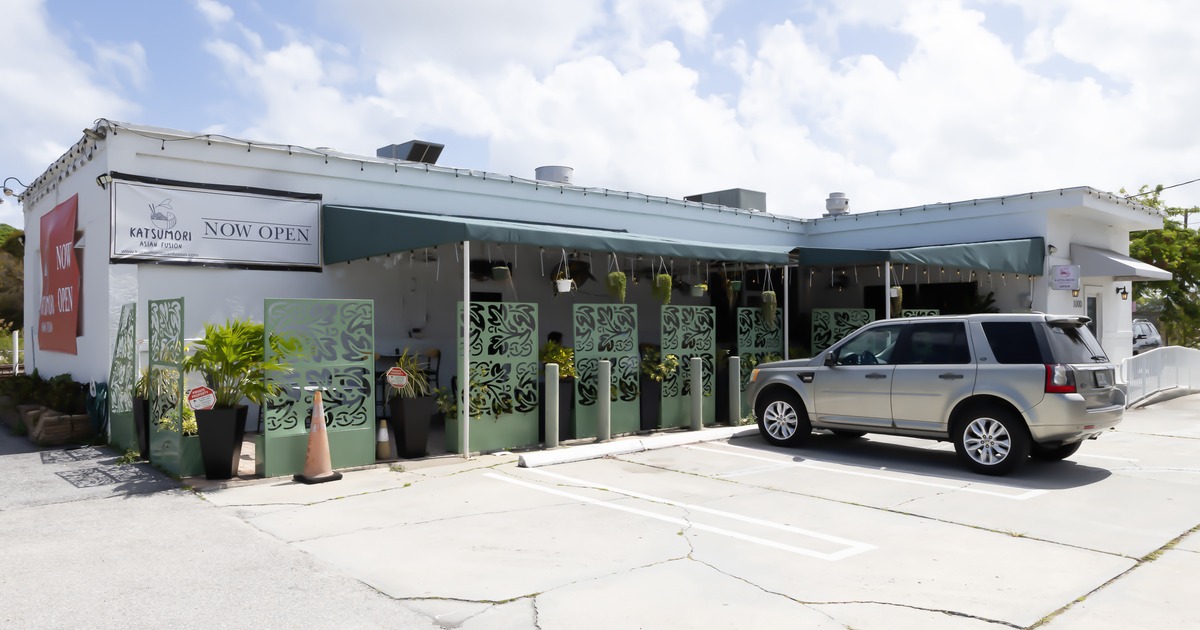 Exterior, front view to restaurant and parking lot
