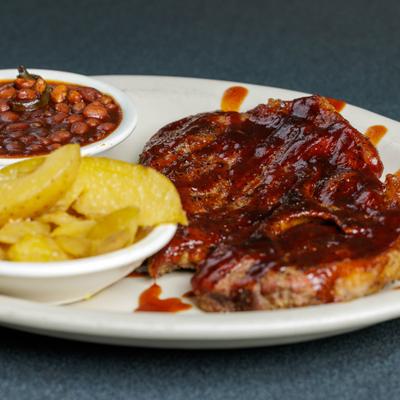Pork steak served, closeup.
