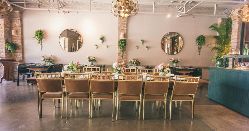 Interior, set dining tables, floral decorations in the room