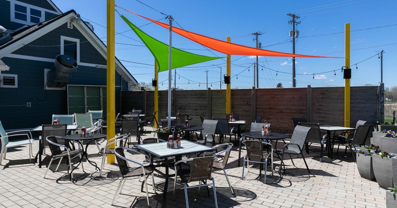 Outdoor patio seating area, tables and chairs