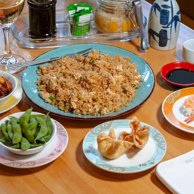 Fried rice platter with edamame and dumplings.