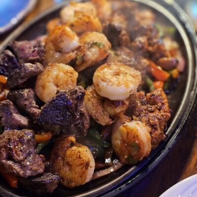 Fajitas 4-2 (for two) - Surf & Turf shown in photo at 13 Tacos & Taps.