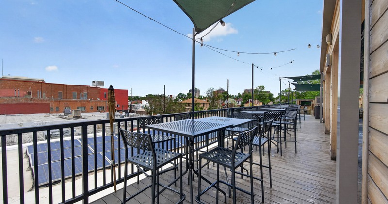 Exterior, high tables and chairs on the rooftop