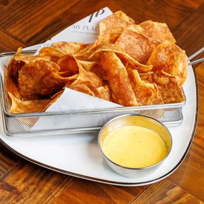 Cajun-spiced potato chips served with garlic Parmesan dipping sauce.