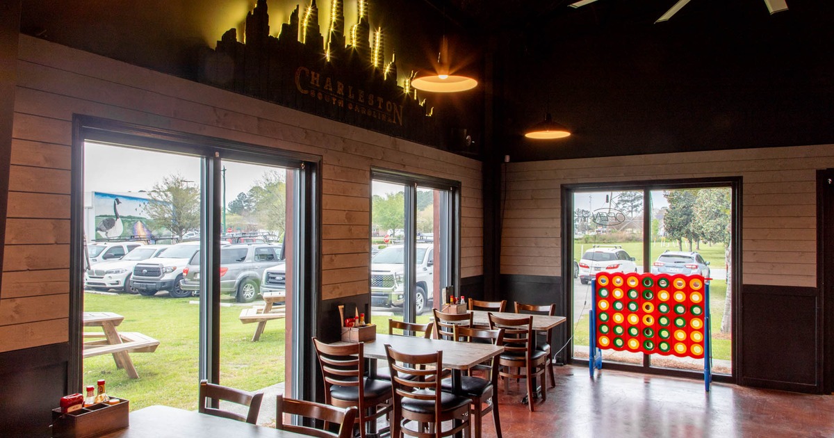 Interior, tables and chairs next to the windows