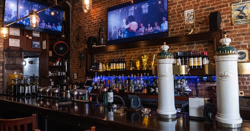 Bar, drink rack, tv screen above