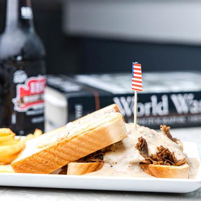 The S.O.S. sandwich and a World War II book next to it.