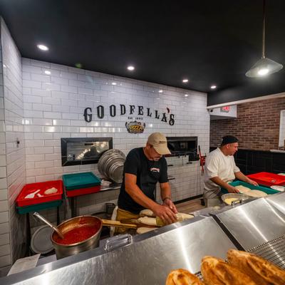 Chefs making pizza dough at Goodfella’s pizzeria kitchen.