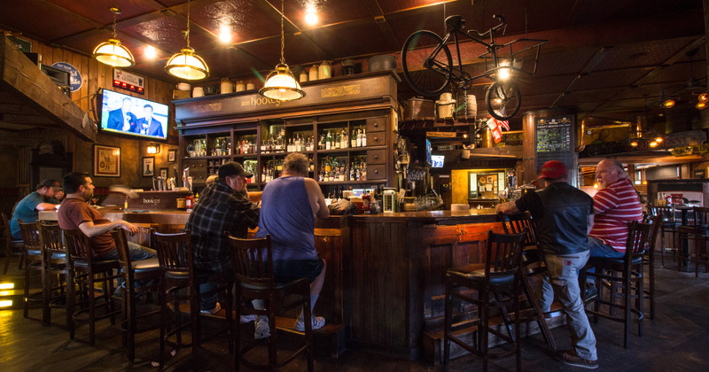 Interior, guests gathered around the bar