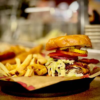 Burger served with fries.