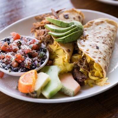 Pulled pork and egg taco meal.