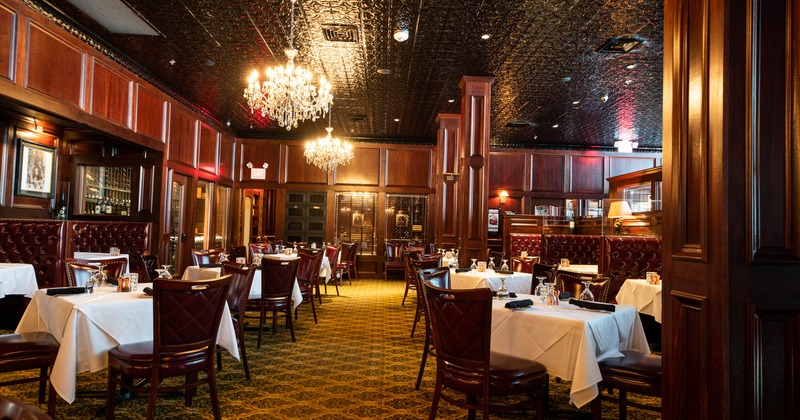Dining area with set tables and booths