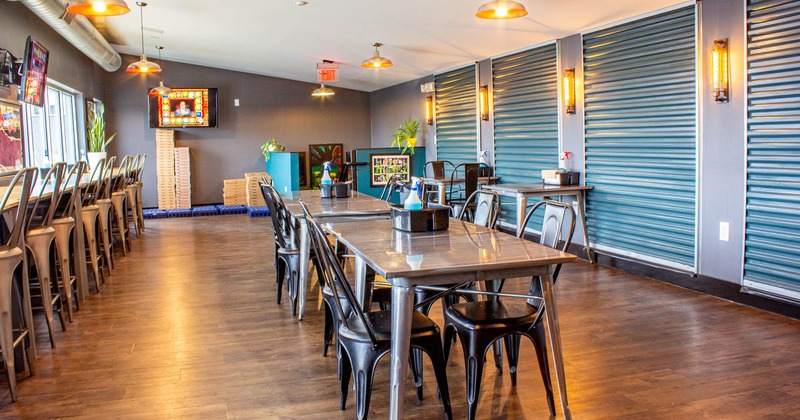 Interior, seating area, tables ready for guests