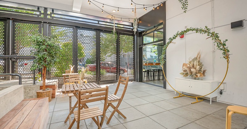 Wooden tables and chairs, floral decorations