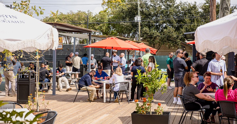 Outdoor seating area, guests sitting at tables