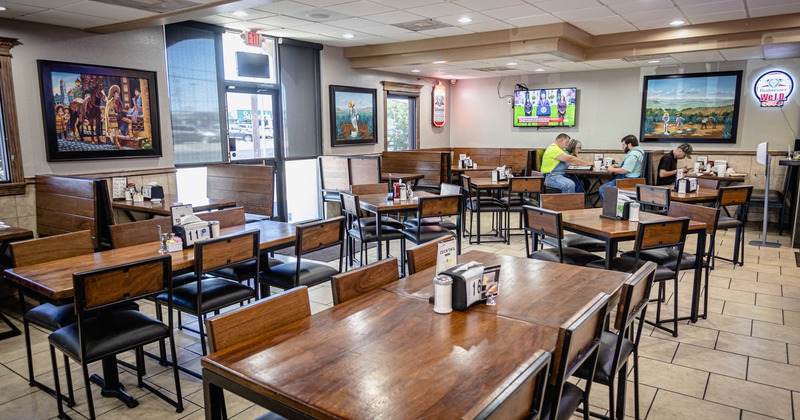 Interior, dining area, guests sitting at tables