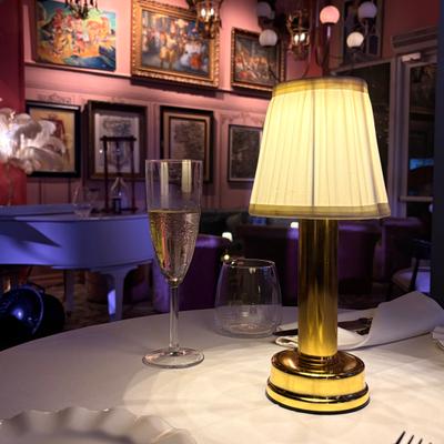 A cup of champagne on a table.