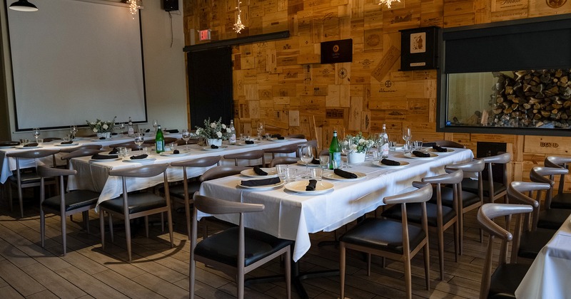 Interior, dining tables with tableware ready for guests