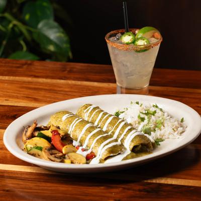 Vegetable Enchiladas with sides of  grilled veggies and cilantro rice, accompanied with Margarita.