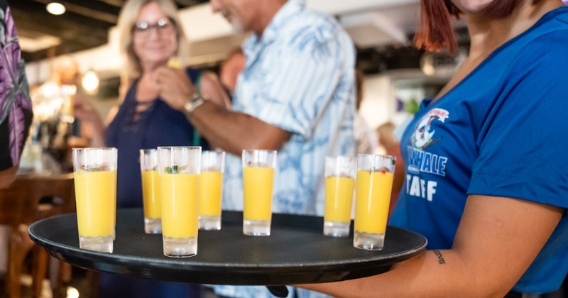 Staff member serving shots