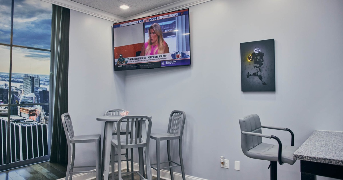 Corner table, TV on the wall