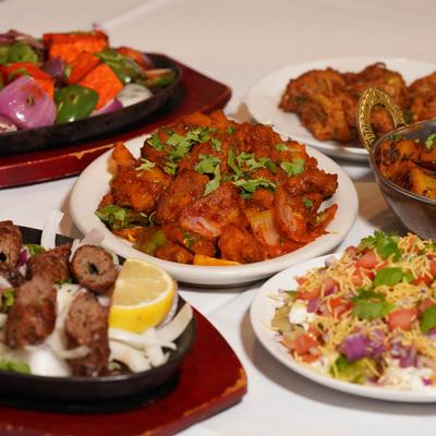 Assorted food dishes spread on a table.