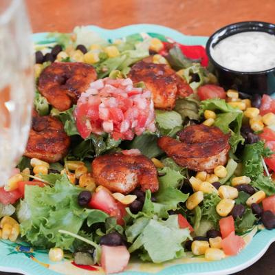 Blackened Shrimp Salad with sauce on the side.