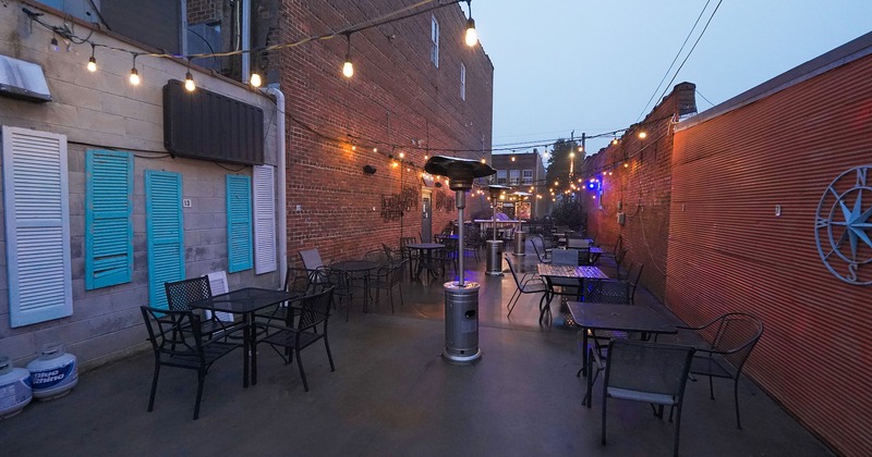 Exterior, patio tables and guests