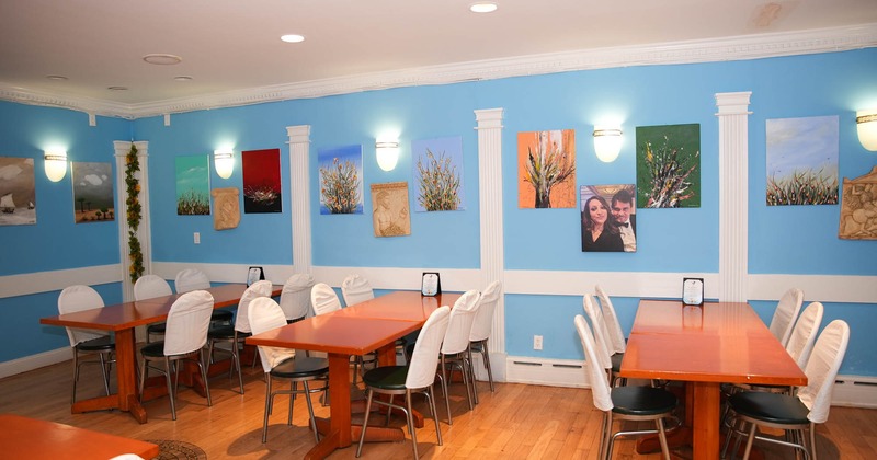 Interior, tables and chairs, pictures on the wall