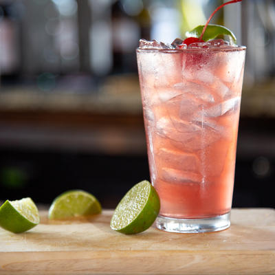 Drink in glass with lime near