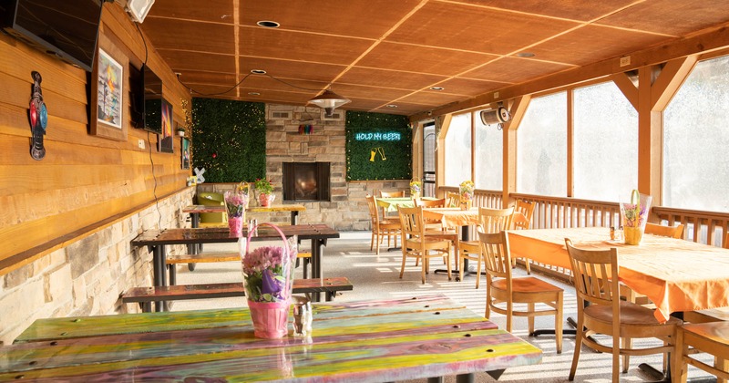 Covered part of the patio with seating and tables