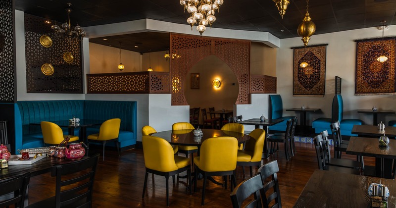 Interior, dining area, ''U'' shaped seating booth, round wooden top table for six