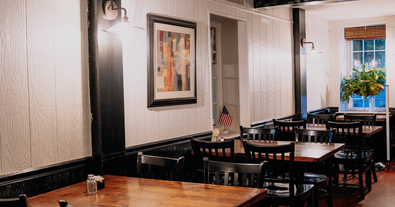 Interior, tables and chairs, framed picture on the wall