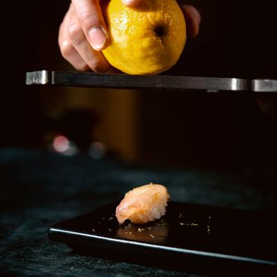Hands preparing a meal.