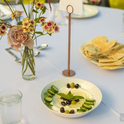 White dip with cucumbers and flat bread