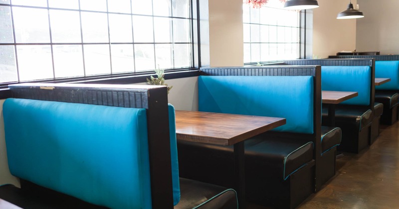 Seating booths by the windows