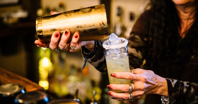 Bartender pouting cocktail