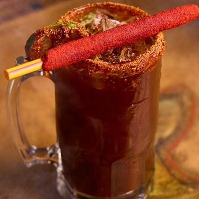 Bloody Mary cocktail garnished with a tamarind stick.