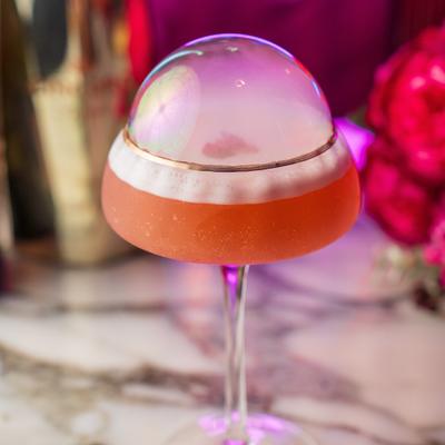 Cocktail with a smoke filled bubble dome.