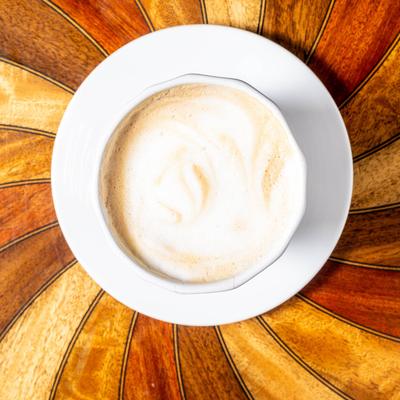 A top view of a served cappuccino.