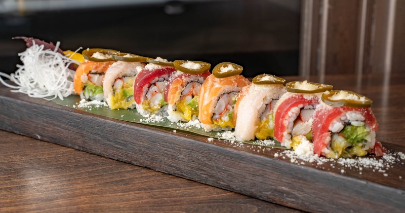 Colorful sushi rolls with shrimp, avocado, tuna, salmon, white fish, and jalapenos