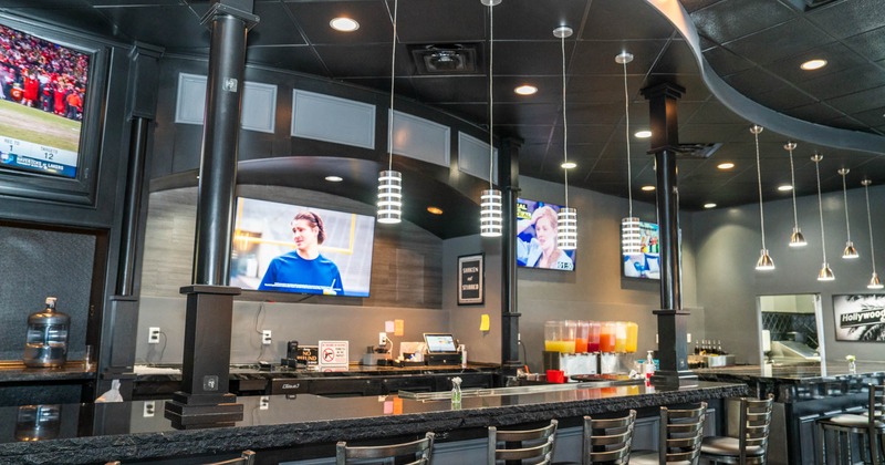 Interior, bar, chairs, tv's above