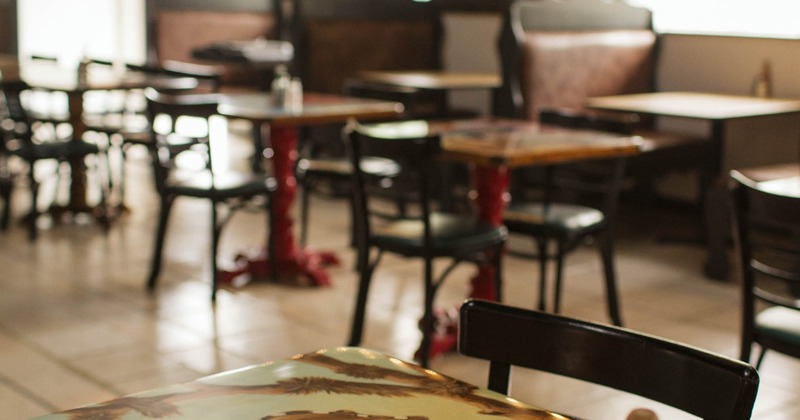Interior, tables and chairs ready for guests